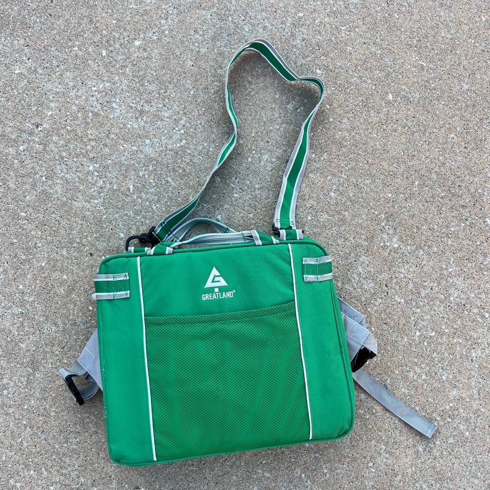Comfortable Green Greatland Stadium Cushion with all straps and handles.